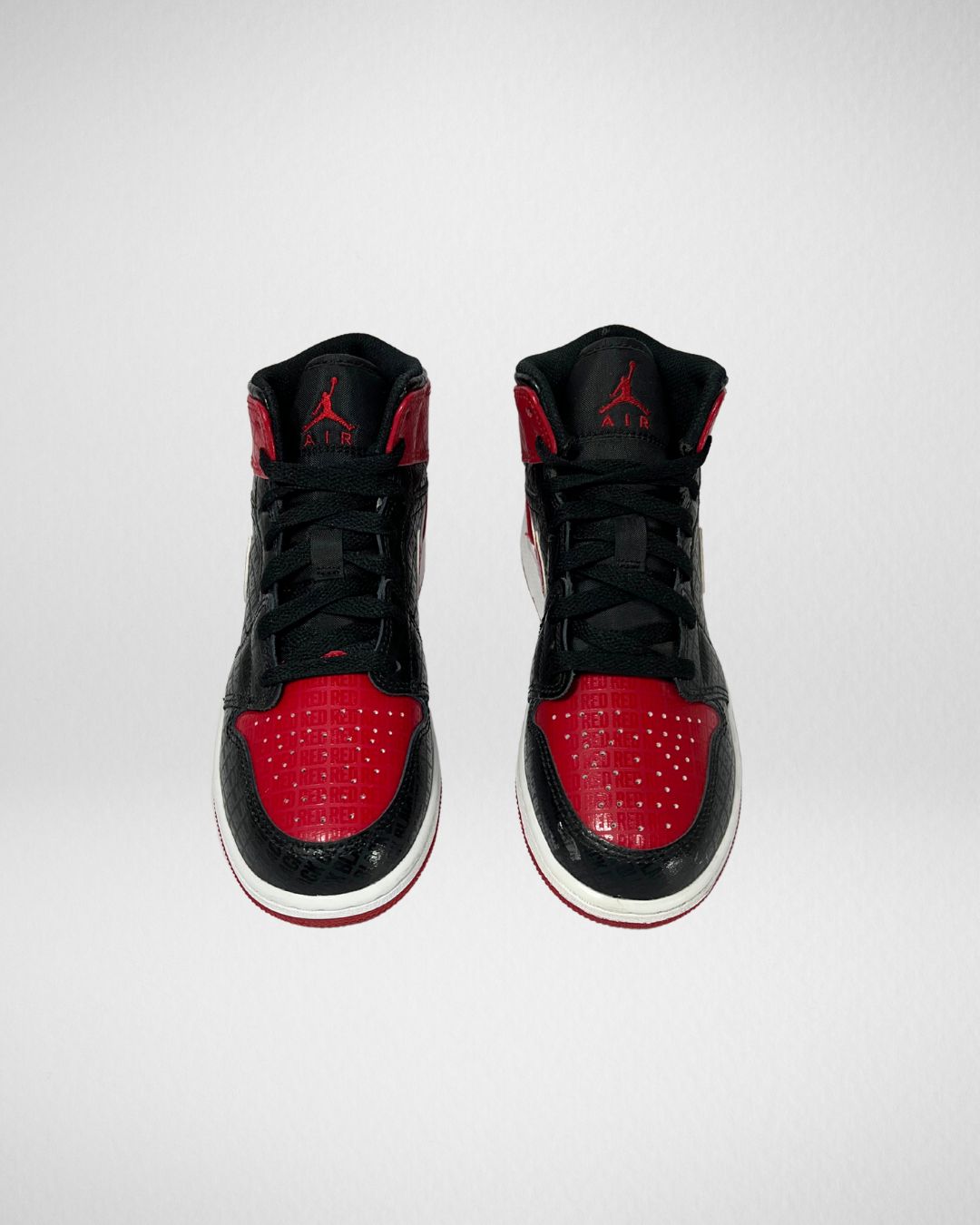 Jordan 1 Mid Bred Text